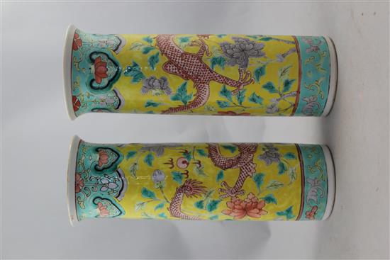 A pair of Chinese famille rose yellow ground sleeve vases, Kangxi mark, late 19th century, 26cm